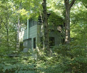 The 'Round-Top' 824-square-foot, three-story homes at Tryon Farm feature a screened third-floor porch and deck nestled into the tree canopy